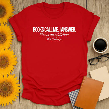 Red book lover shirt with the phrase 'Books call me. I answer. It's not an addiction, it's a duty.' Perfect for cozy reading days.