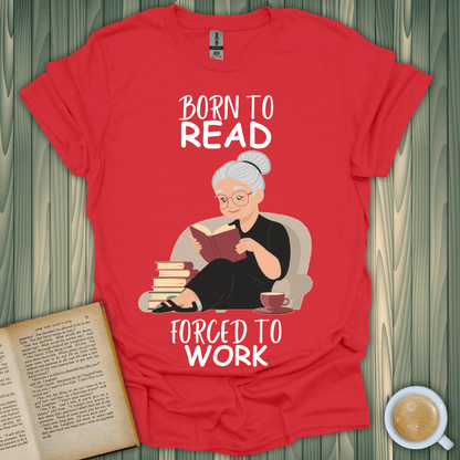 Born to Read, Forced to Work t-shirt featuring a book lover enjoying a good book in a cozy setting.