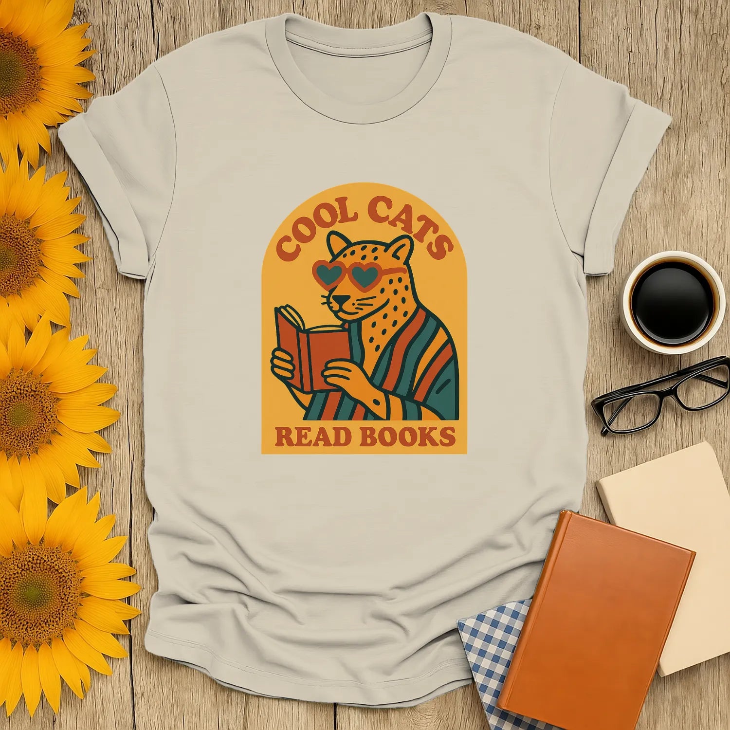 Cool Cats Read T-Shirt featuring a stylish cat in heart-shaped shades holding a book, perfect for book lovers and cozy vibes.
