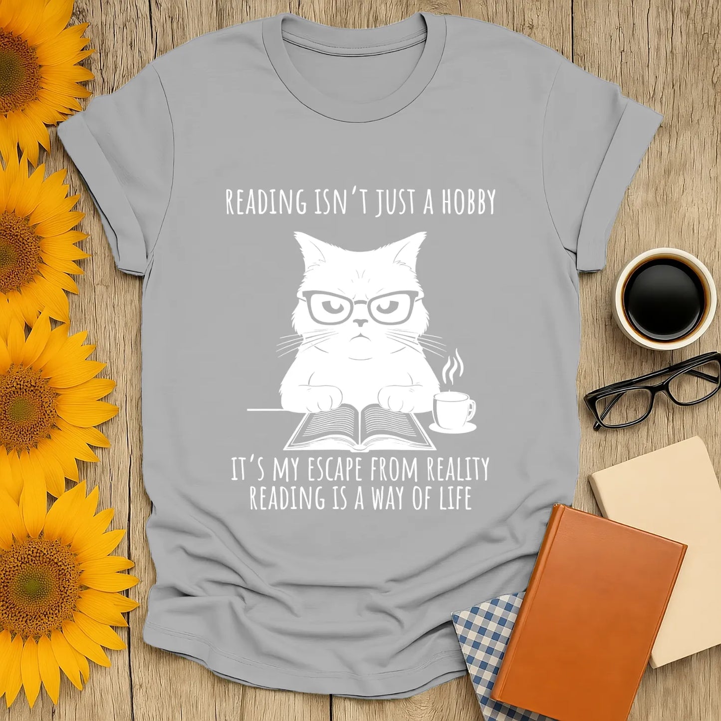 Funny reading tee with a grumpy cat in glasses, coffee, and a book, perfect for book lovers and cozy reading moments.