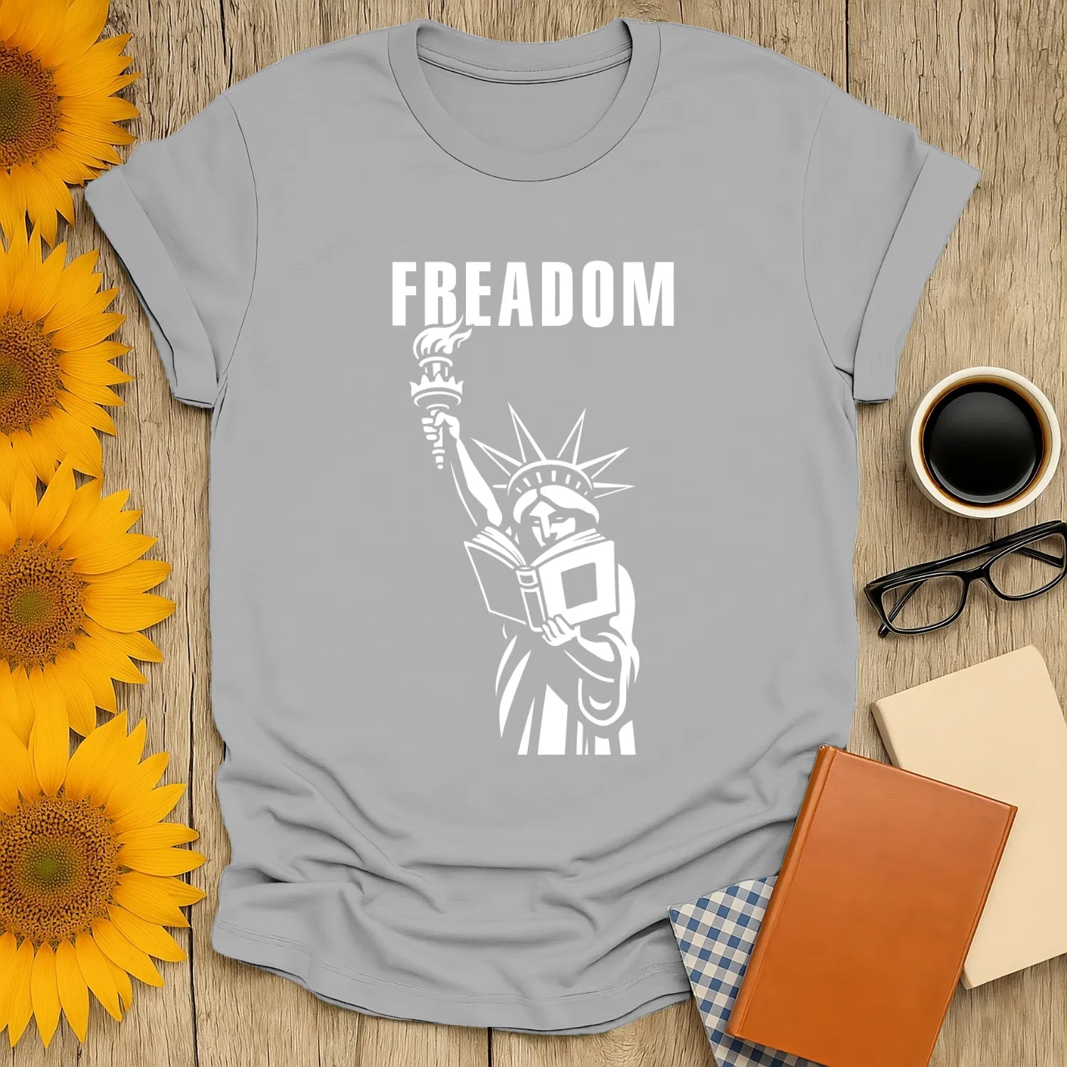 Freadom Statue T-Shirt with Liberty holding a book and torch, perfect gift for book lovers who enjoy cats, coffee, or tea.