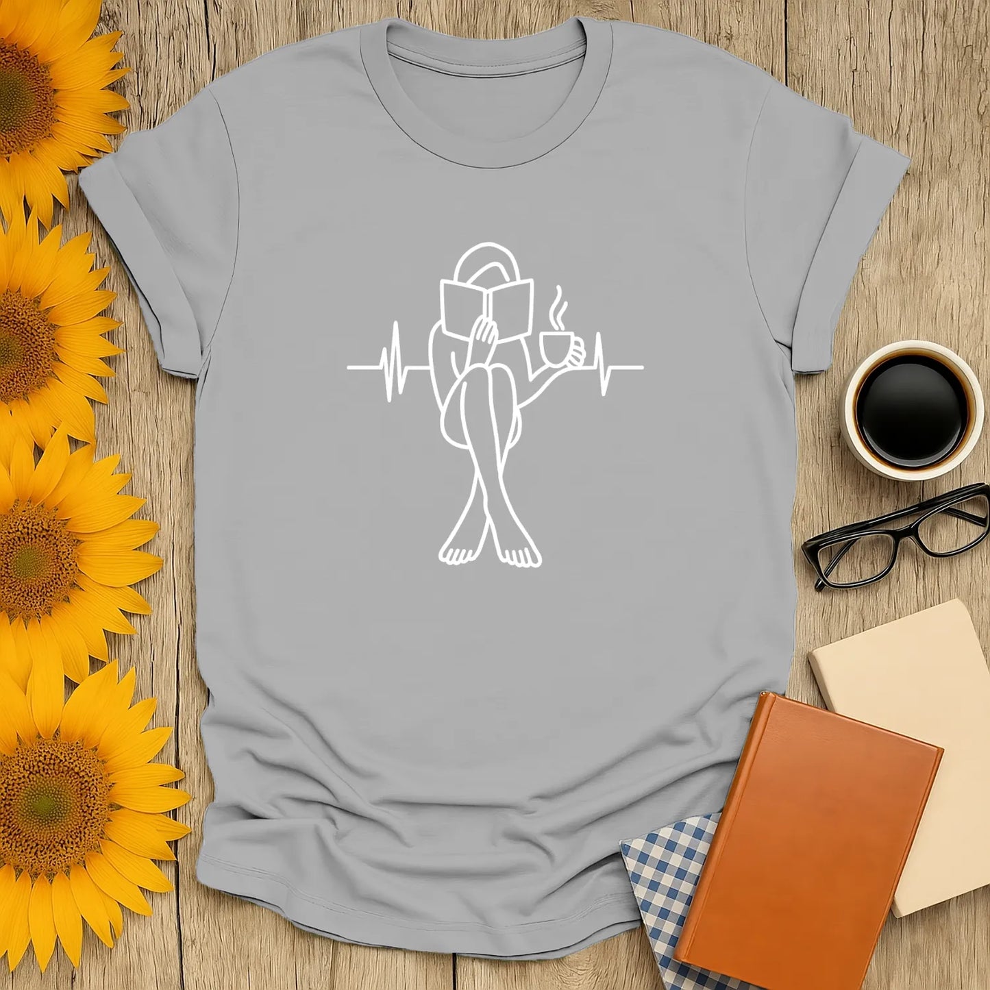Minimalist book lover shirt featuring a person reading with a coffee cup, perfect gift for cozy readers who love cats and books.
