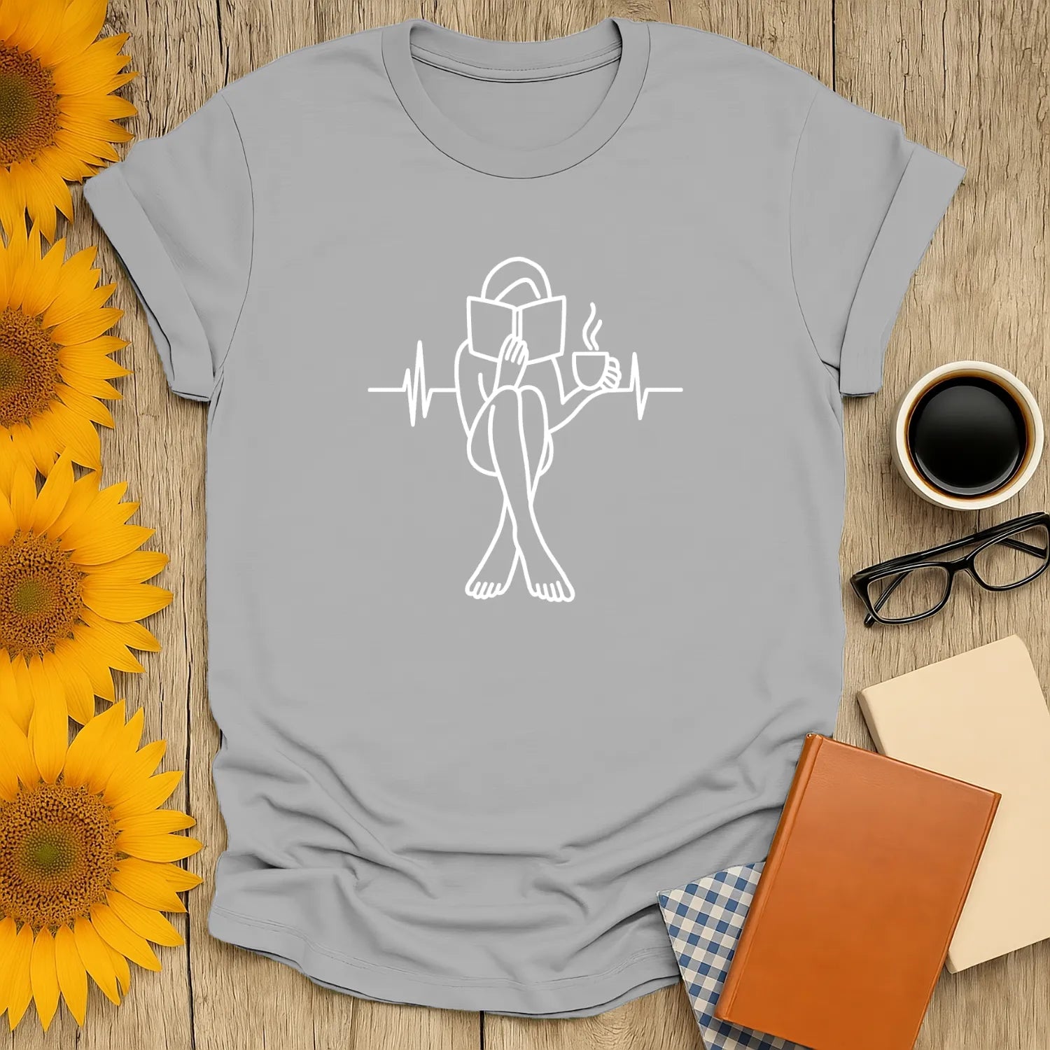 Minimalist book lover shirt featuring a person reading with a coffee cup, perfect gift for cozy readers who love cats and books.