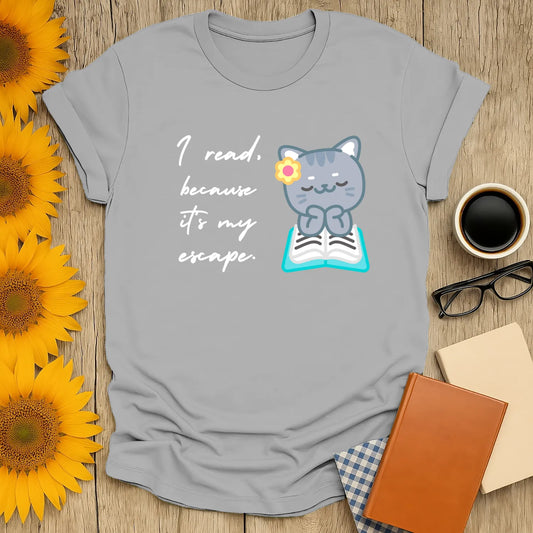 Funny reading tee featuring a cute cat on a book with the text 'I read because it's my escape', perfect for book lovers.
