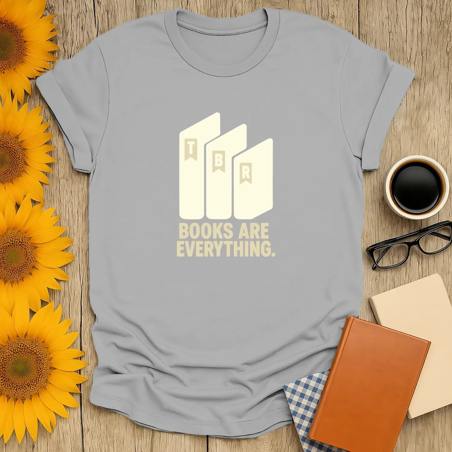 Light gray book lover t-shirt with "Books Are Everything" and TBR book illustration, perfect for cozy reading moments.
