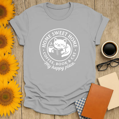 Cozy cat reading shirt featuring a cat, coffee, and book with text: 'Home Sweet Home'. Perfect gift for reading cat lovers.
