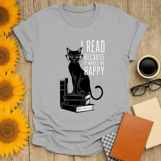 Funny reading tee featuring a black cat in glasses on stacked books with the text 'I read because it makes me happy'.