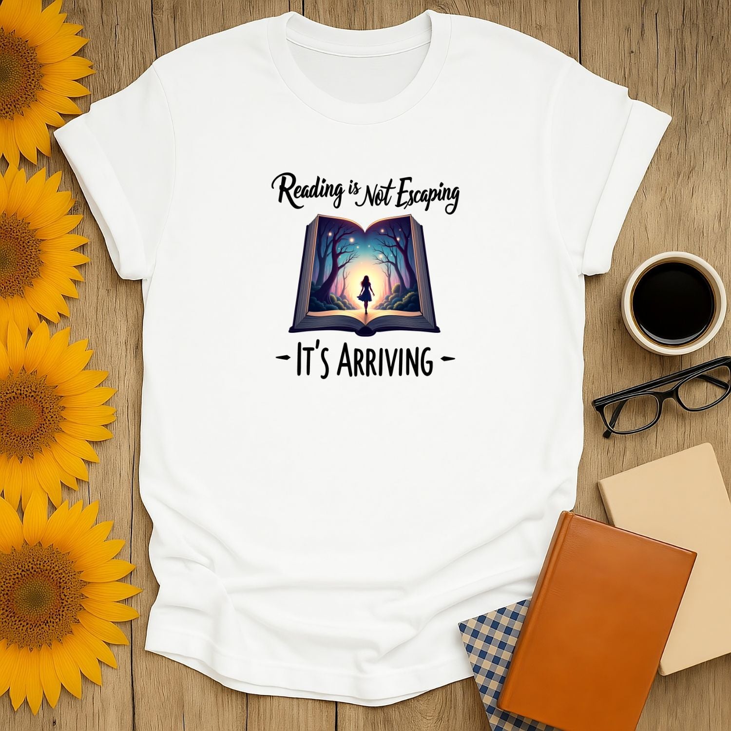 Cozy book lover shirt featuring 'Reading is Not Escaping, It's Arriving' with whimsical illustration; perfect gift for readers.