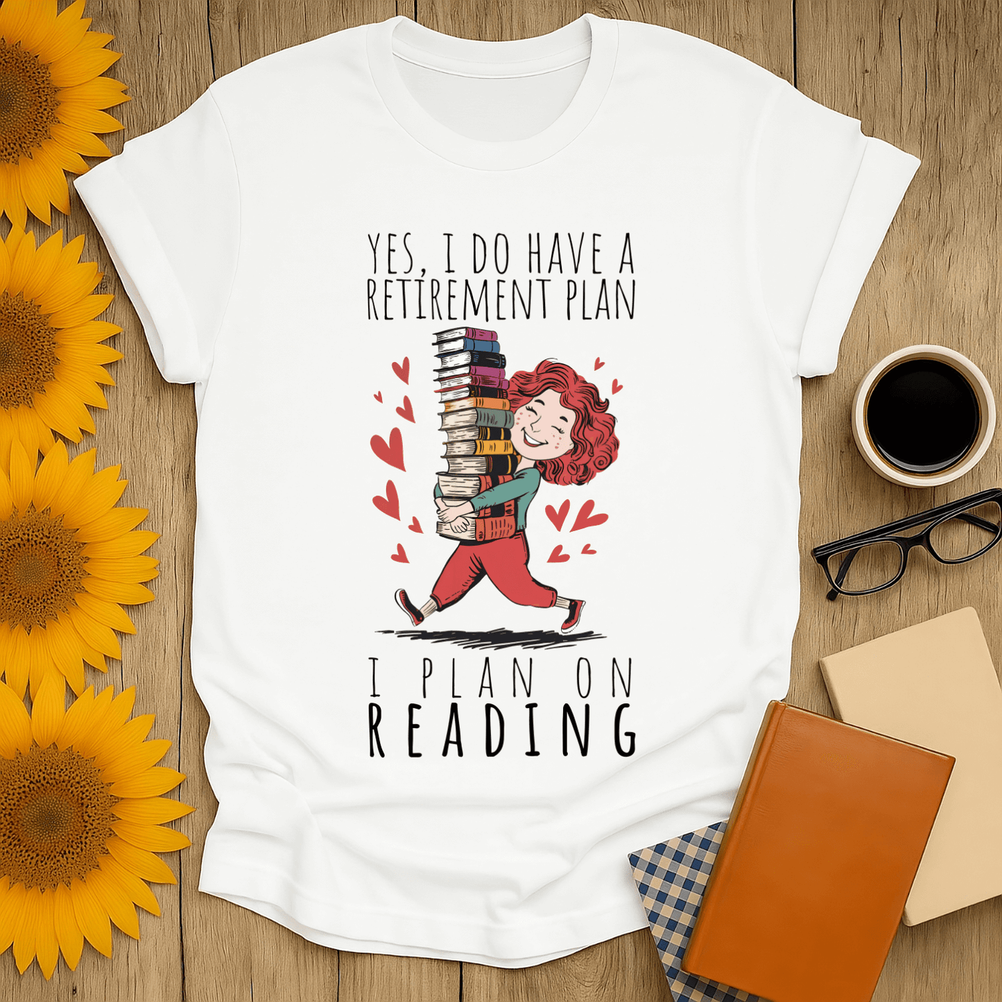 White t-shirt with "I Plan on Reading" graphic, perfect for book lovers and showcasing a love for reading.