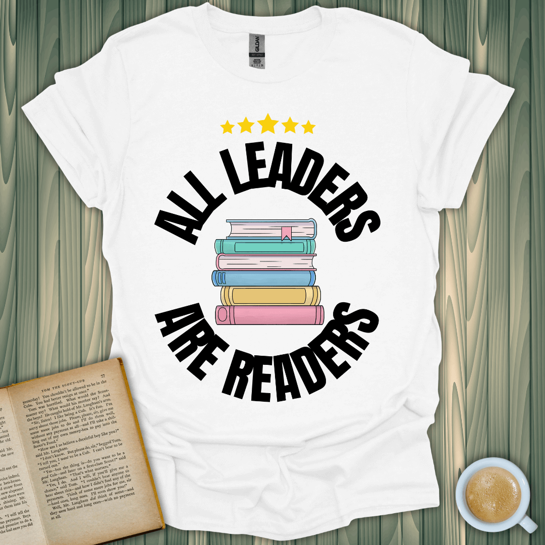 Leaders Are Readers T-Shirt featuring a stack of colorful books, perfect for book lovers, made of 100% cotton.