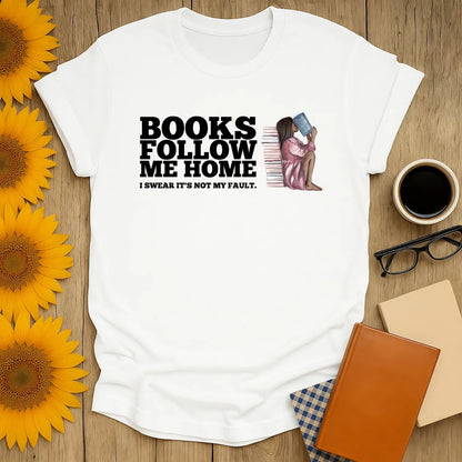 Funny book lover shirt with art of a woman reading, saying 'Books follow me home'—perfect gift for cozy readers!