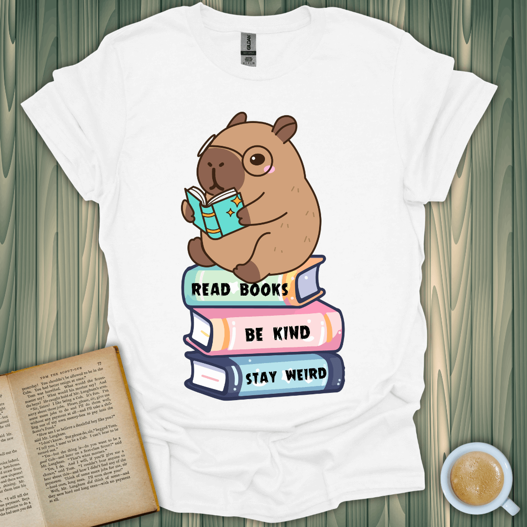 Capybara Reader T-Shirt featuring a cute capybara reading a book on colorful books, perfect for book lovers.