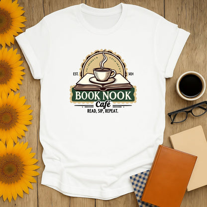 Cozy Book Nook Cafe shirt featuring a steaming coffee cup & book design, perfect gift for coffee-loving bookworms.