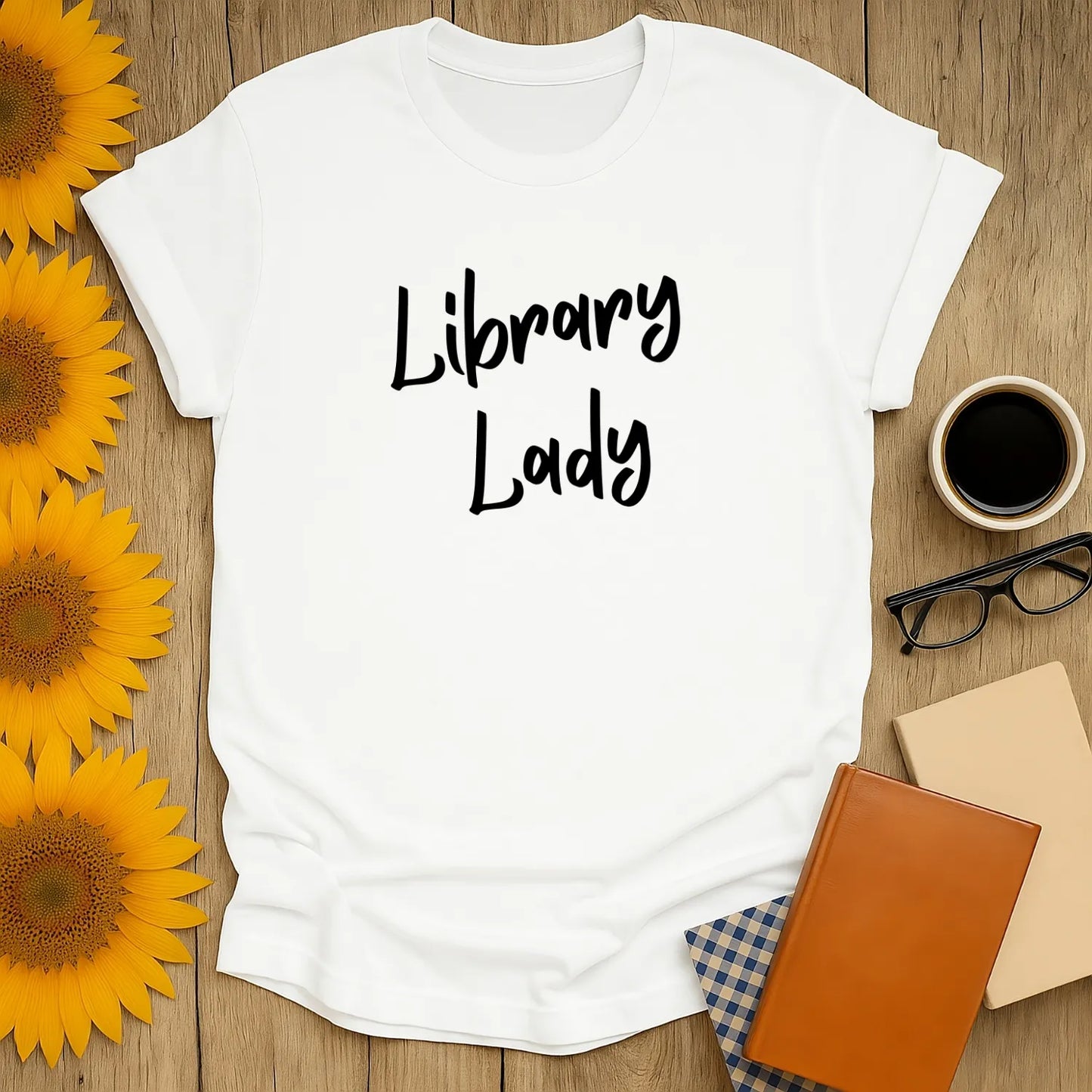 Cozy white t-shirt featuring 'Library Lady' in playful text—perfect for book lovers and a great gift for readers!