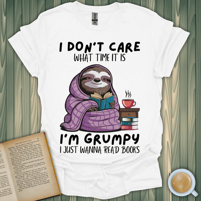 Grumpy sloth t-shirt for book lovers, cozy design, perfect for reading enthusiasts. 100% cotton, unisex fit.