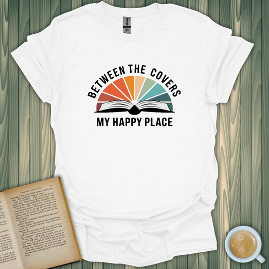 My Happy Place T-Shirt for book lovers, featuring a vibrant design with an open book and colorful rays, made from soft cotton.