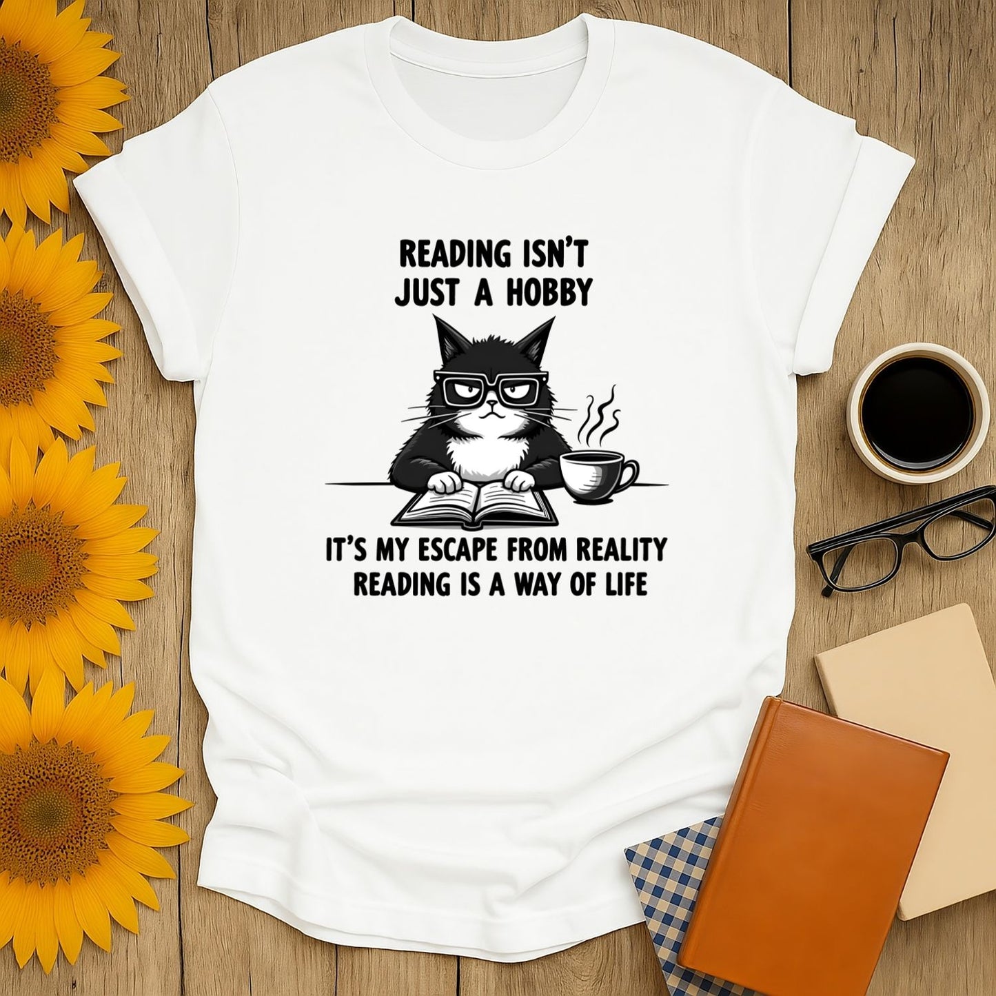 Grumpy cat t-shirt for book lovers with reading quotes on a cozy setup with flowers and books.