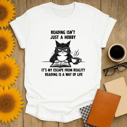 Grumpy cat t-shirt for book lovers with reading quotes on a cozy setup with flowers and books.