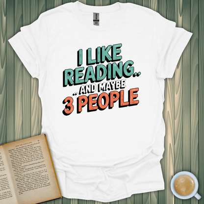 Unisex white t-shirt with 'I Like Reading.. and maybe 3 People' design, perfect for book lovers who enjoy humor.