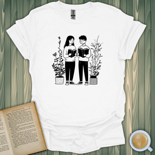 Bookish Buddies T-Shirt for book lovers, featuring a charming design of two friends reading surrounded by plants.