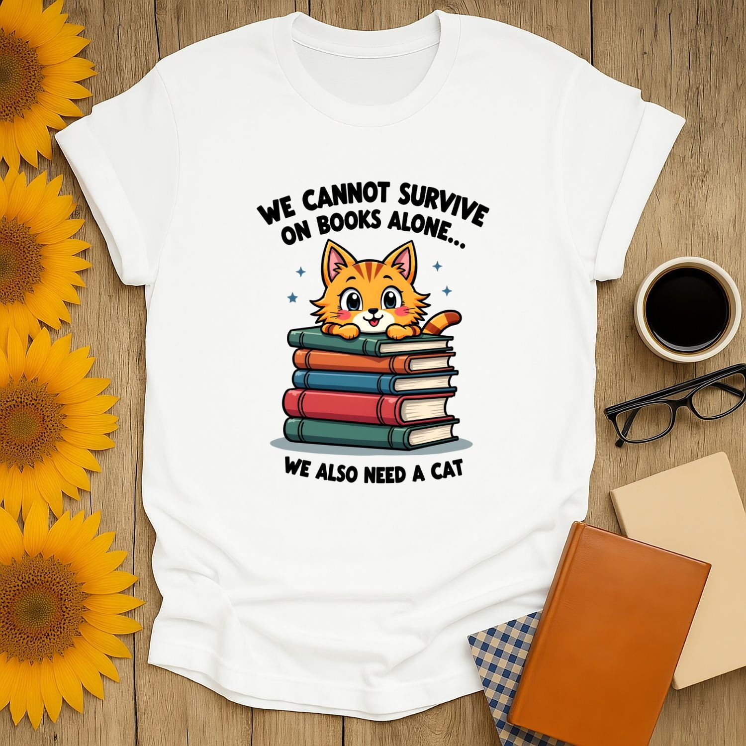 Cute cat graphic on a white t-shirt with books, perfect for book lovers and cat enthusiasts.