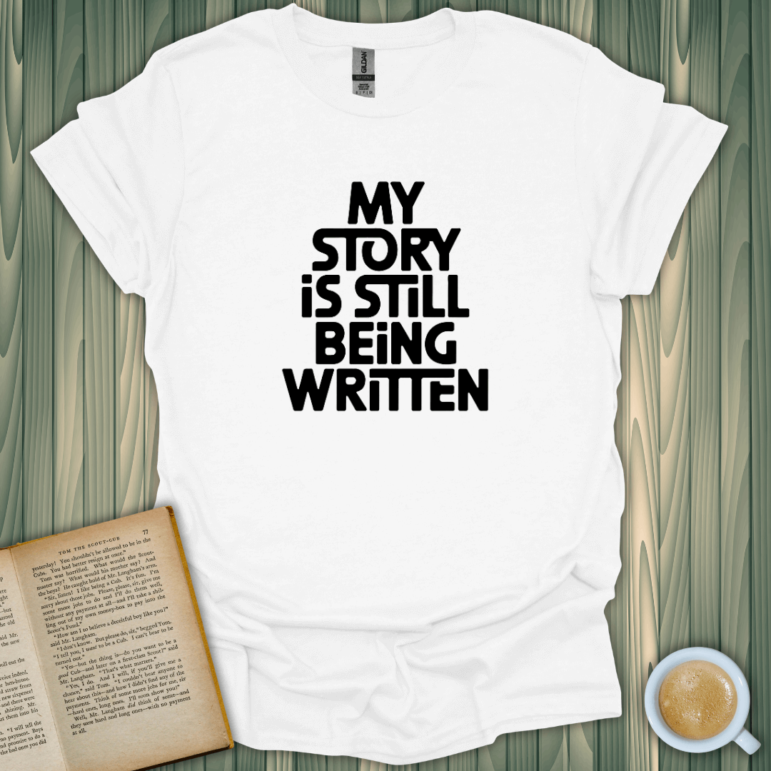 Story Still Writing T-Shirt for book lovers, featuring bold print on breathable cotton, perfect for cozy reading moments.