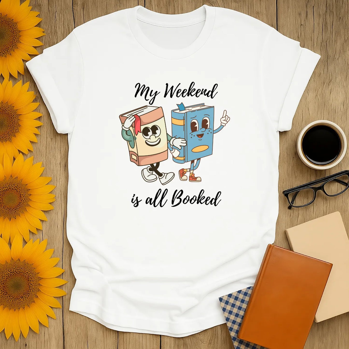 My Weekend is All Booked tee featuring playful book characters, perfect cozy gift for cat and coffee-loving bookworms.