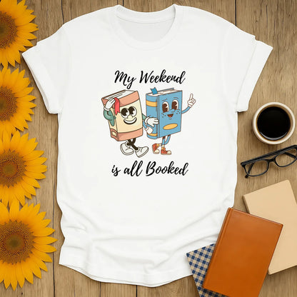 My Weekend is All Booked tee featuring playful book characters, perfect cozy gift for cat and coffee-loving bookworms.