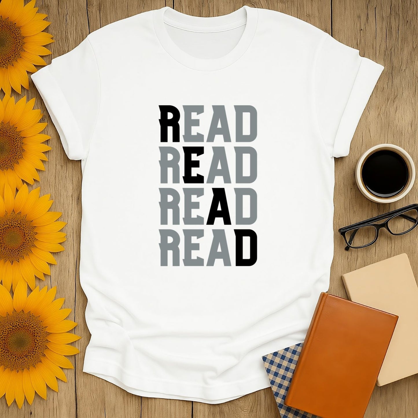 Cozy book lover shirt featuring 'READ' stacked in a fun font—perfect gift for readers who adore cats, coffee, and humor.
