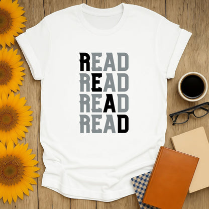 Cozy book lover shirt featuring 'READ' stacked in a fun font—perfect gift for readers who adore cats, coffee, and humor.