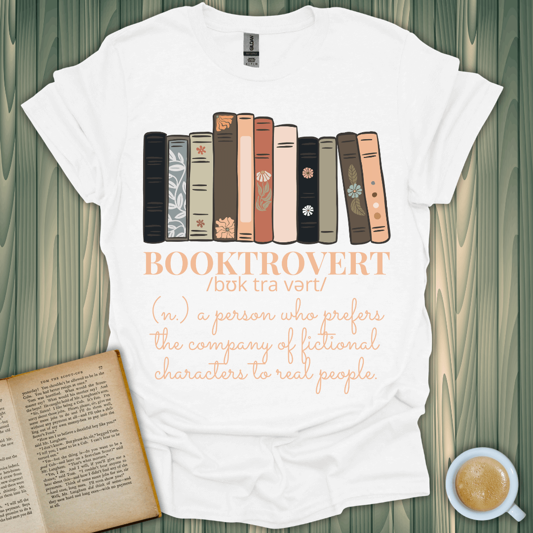 Booktrovert T-Shirt for book lovers, featuring a cozy design with books and playful text about fictional characters.