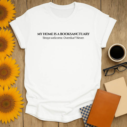 White t-shirt with 'My home is a book sanctuary' print, perfect for book lovers, featuring a unisex fit and soft fabric.