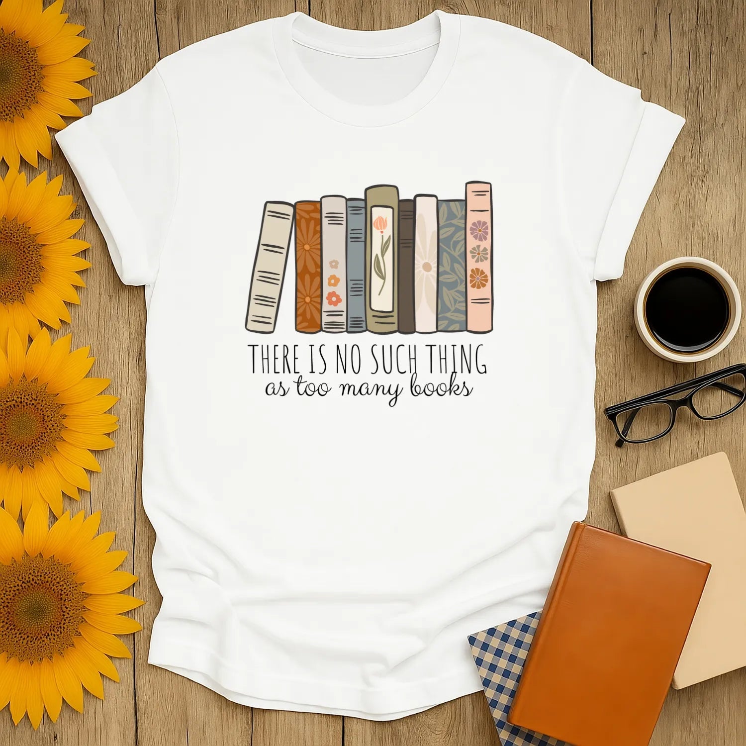 Funny reading tee with stacked books and the text 'There is no such thing as too many books' perfect for book lovers.