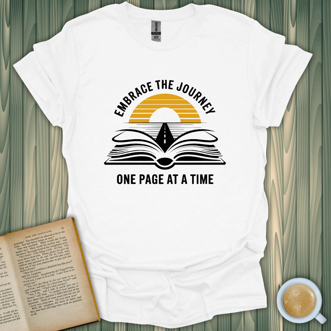 Embrace the Journey T-Shirt for book lovers, featuring a screen-printed design of an open book with sunset.