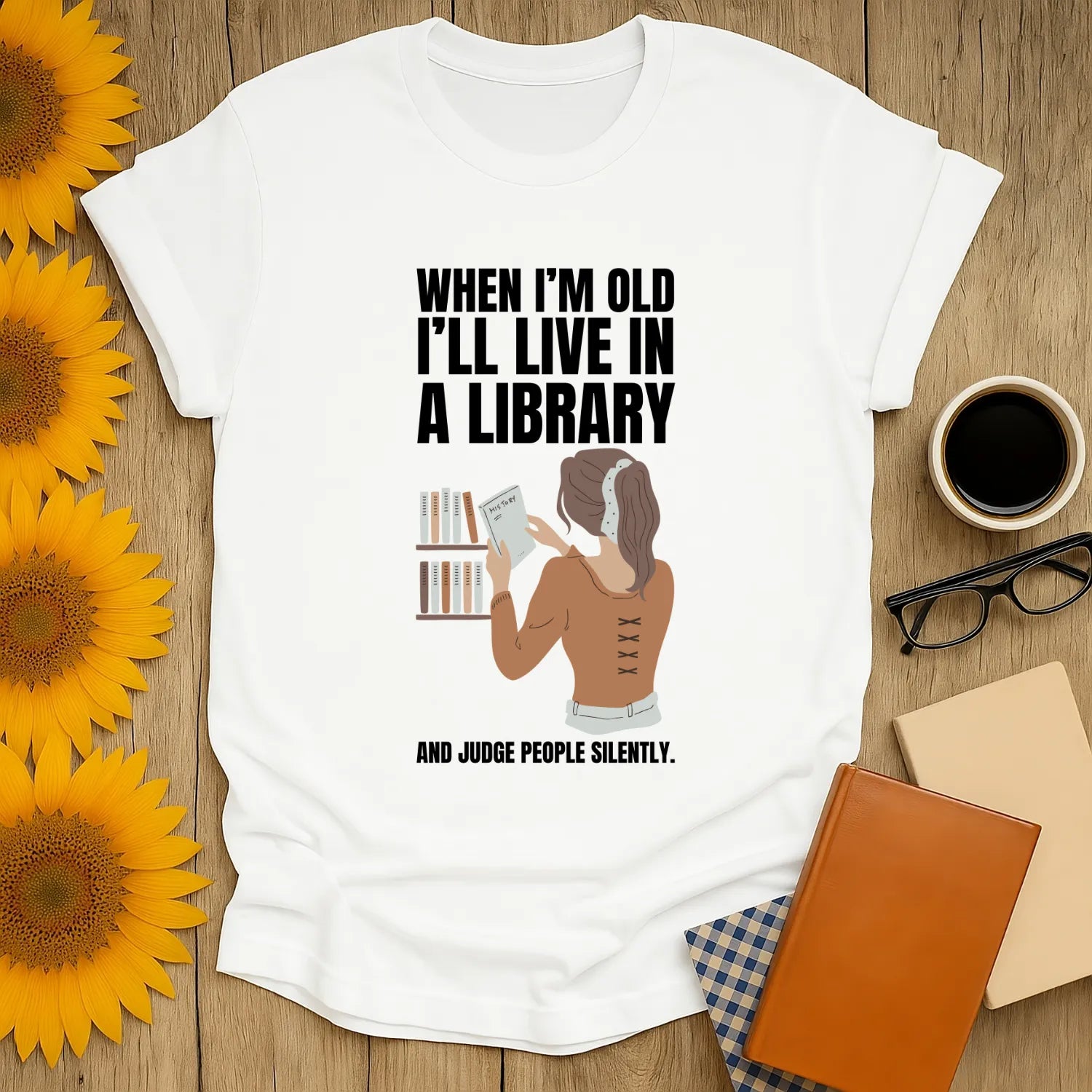 Future Library Lady T-Shirt featuring a woman reading, with humorous text about judging silently—perfect for cozy book lovers!